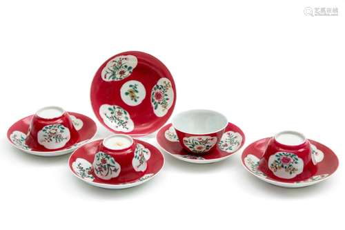 Four ruby ground tea bowls and saucers