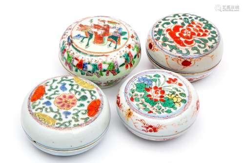 Four round lidded boxes