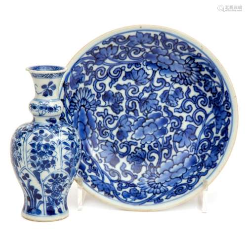 A small blue and white dish and vase