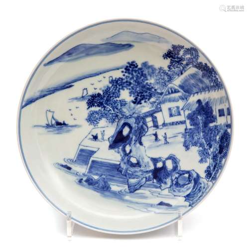 A blue and white landscape dish