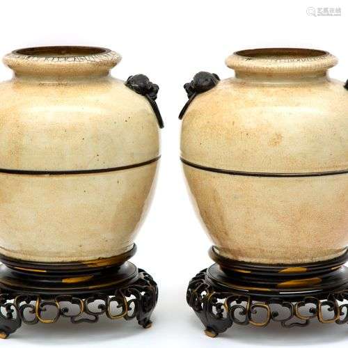 Two Nanking ware vases mounted on a brass base