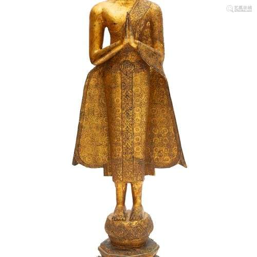 A large standing bronze Buddha