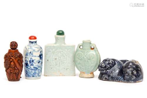 A blue glazed porcelain water dropper and four snuff bottles