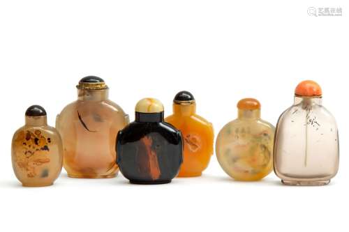 Six Chinese carved hardstone snuff bottles