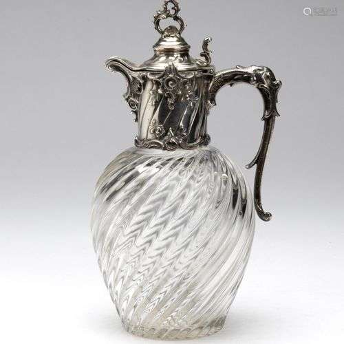 A cut-glass decanter with German silver mounting