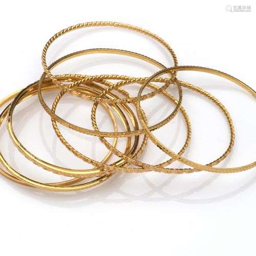 Nine 20k gold bangles