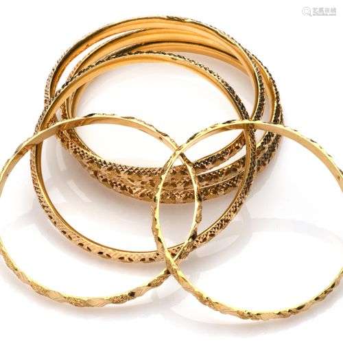 Six 20k gold bangles