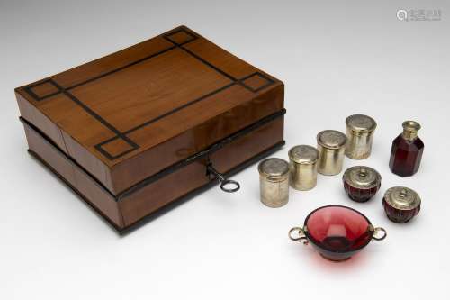 A German wooden travel case with silver-gilt and ruby glass ...