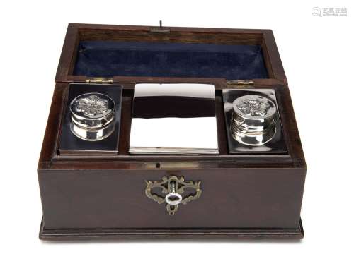 A wooden box with three Dutch silver tea caddies