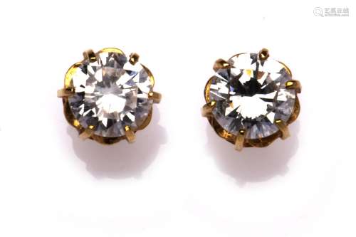 A pair of 20k gold diamond single stone earstuds