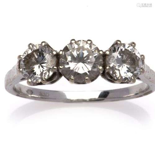A 14k white gold diamond three stone ring