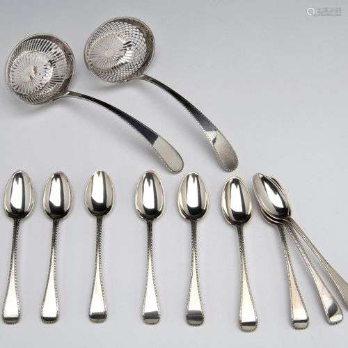 Two Dutch silver sugar sifters and nine matching teaspoons
