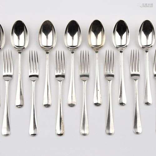 Twelve Dutch silver table spoons and eleven silver table for...