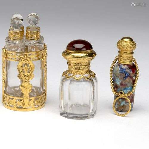 Three scent bottles with gold and gilt mounting and covers