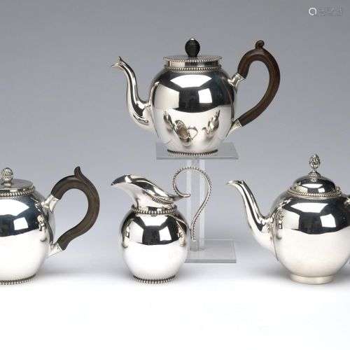 Three Dutch silver teapots and a milk jug, Bonebakker
