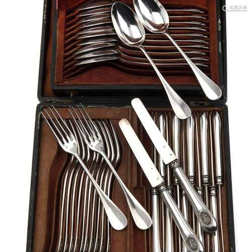 Twelve French silver dessert spoons and twelve dessert forks...