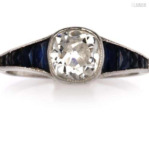 A platinum sapphire and diamond ring