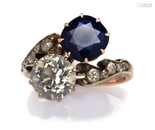 A Russian 14k gold sapphire and diamond crossover ring