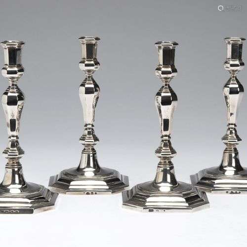 Four Dutch silver candlesticks