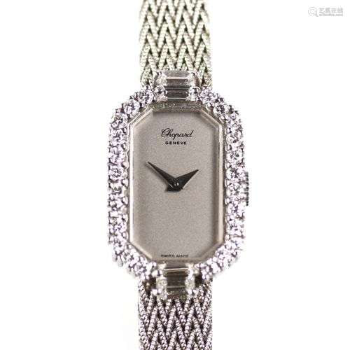 An 18k white gold lady's diamond bracelet watch, by Chopard