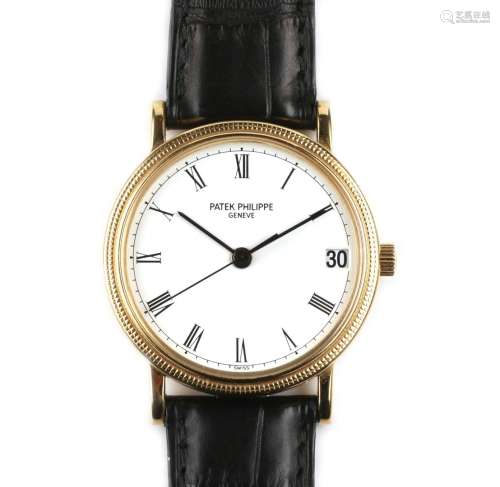 An 18k gold gentlemen's wristwatch with date, by Patek Phili...