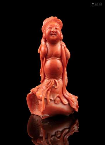 *A RED CORAL CARVING OF A STANDING BUDAI China, Early 20th c...