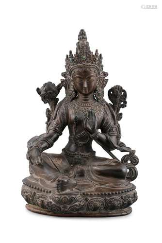 A BRONZE FIGURE OF A SEATED TARA Possibly Nepal and 19th cen...