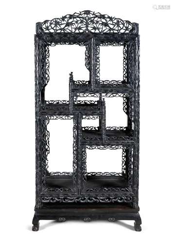 *AN EXOTIC WOOD SHELVES CABINET China, Qing Dynasty, 19th ce...