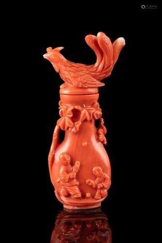 *A CARVED RED CORAL 'PHOENIX AND BOY' SNUFF BOTTLE WITH MATC...