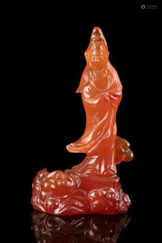 A CARNELIAN FIGURE OF A STANDING GUANYIN China, Likely circa...