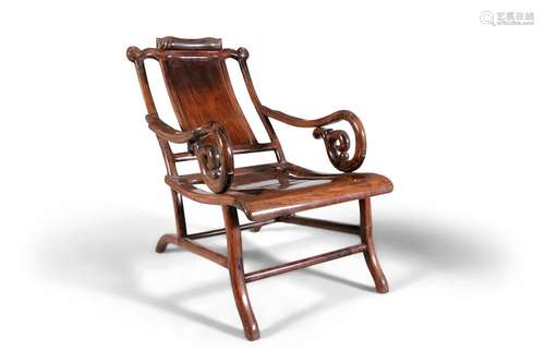 A CHINESE HARDWOOD RECLINING OPIUM CHAIR China, Qing Dynasty...