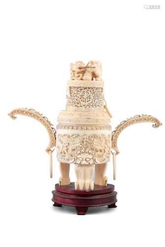 *A CARVED AND PARCEL RETICULATED IVORY THREE-LEGGED INCENSE ...