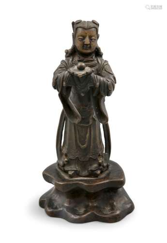 A BROWN PATINA BRONZE FIGURE OF A STANDING ATTENDANT China, ...