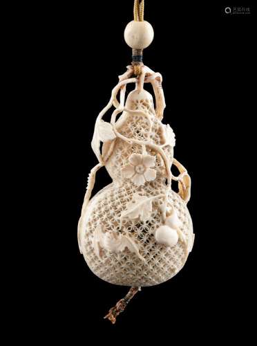 *A RETICULATED IVORY CALABASH-SHAPED PARFUMIER / LIDDED BOX ...