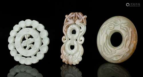 A GROUP OF THREE (3) JADE CARVINGS China The first one is an...