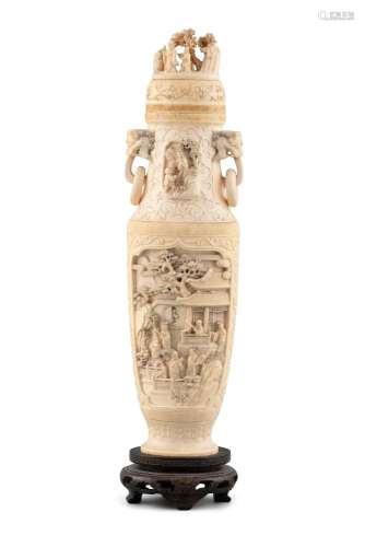 *A CARVED IVORY LIDDED URN WITH LOOSE RING HANDLES China, Po...