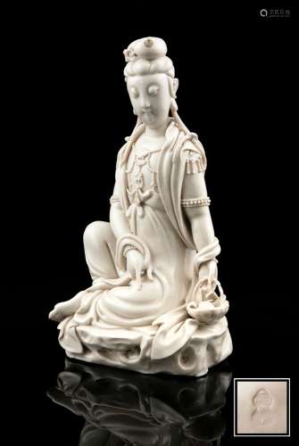 A LARGE DEHUA FIGURE OF A SEATED GUANYIN IMPRESSED WITH A HE...