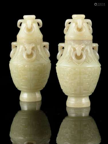 A PAIR OF SMALL JADE LIDDED URNS WITH LOOSE RINGS China, Qin...