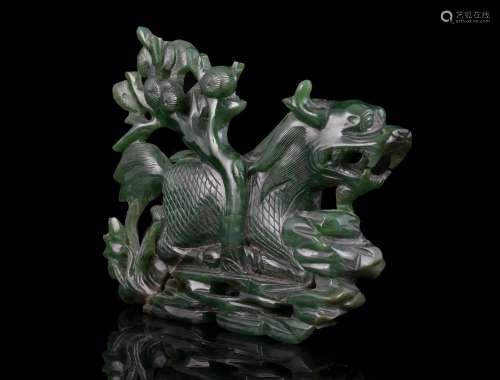 A SPINACH JADE CARVING OF A MYTHICAL BEAST / QILIN China, Qi...