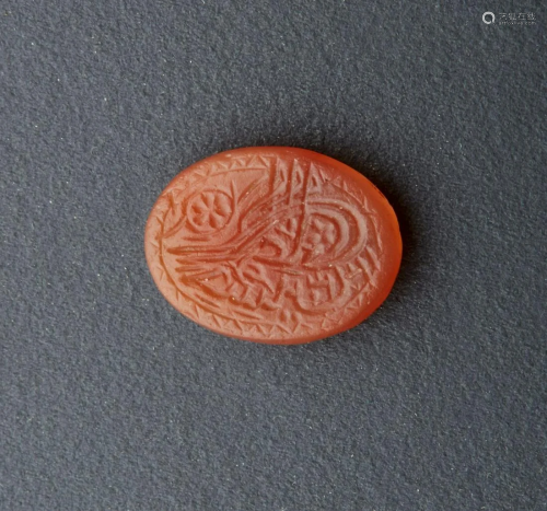 Arte Islamica A small carnelian seal carved with