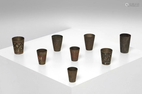 Arte Islamica A group of eight metal cups engraved