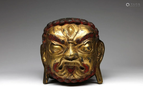 Arte Himalayana A large gilded copper embossed head of