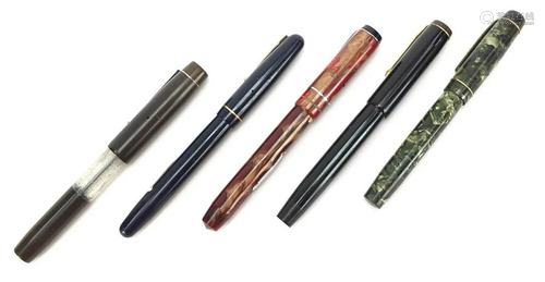 Five vintage fountain pens, four with gold nibs