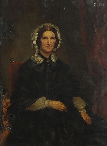 Three quarter length portrait of a seated lady wearing