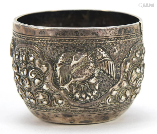 Tibetan silver cup profusely embossed with birds and