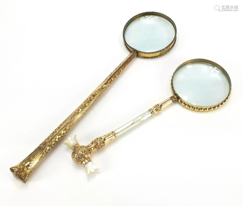 Two large antique gilt metal magnifying glasses