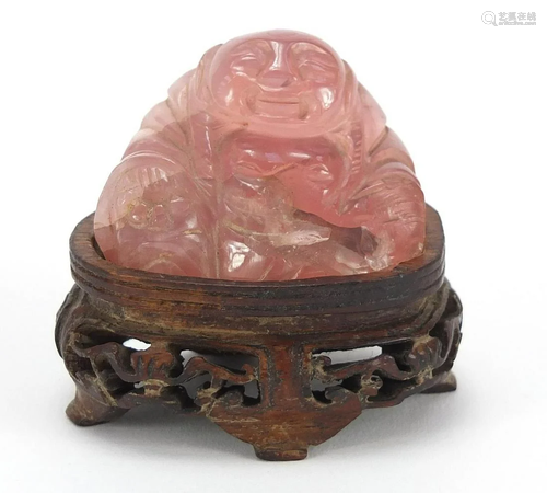 Chinese rose quartz carving of Buddha raised on a