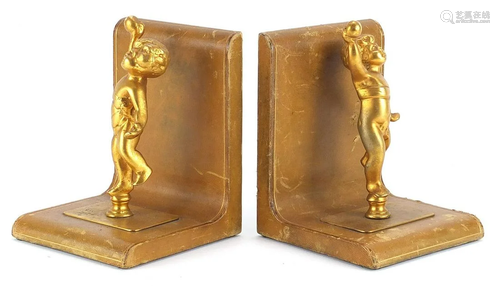 Pair of tooled leather and gilt metal Putti design