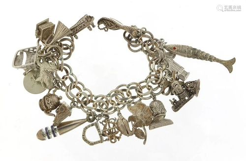 Silver charm bracelet with large selection of mostly