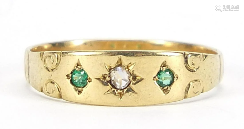 Unmarked 18ct gold diamond and emerald three stone